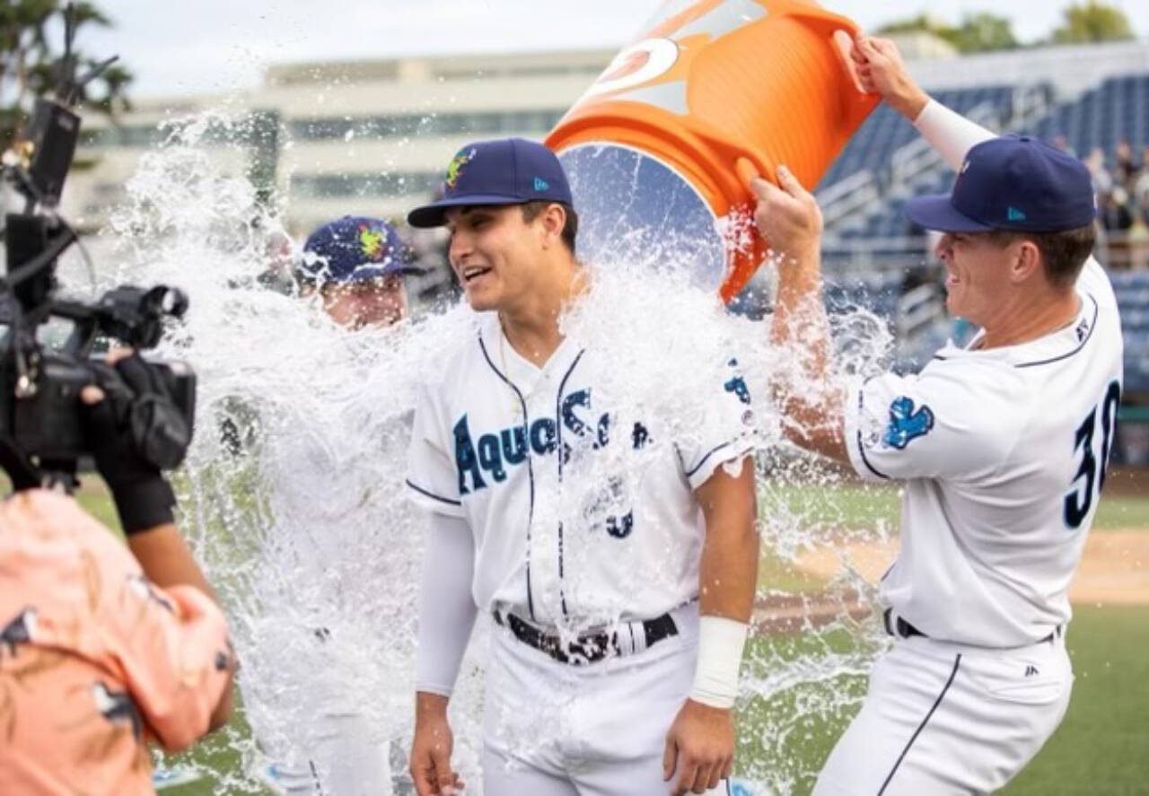 AquaSox shortstop Ben Ramirez is doused with water by teammates after the AquaSox beat the Eugene Emeralds to clinch a playoff berth, Sept. 4, in at Funko Field in Everett. (Photo provided by AquaSox)
