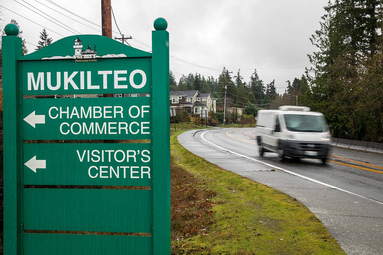 Traffic moves along Mukilteo Speedway in front of Olympic Middle School on Thursday, Dec. 7, 2023 in Everett, Washington. (Olivia Vanni / The Herald)