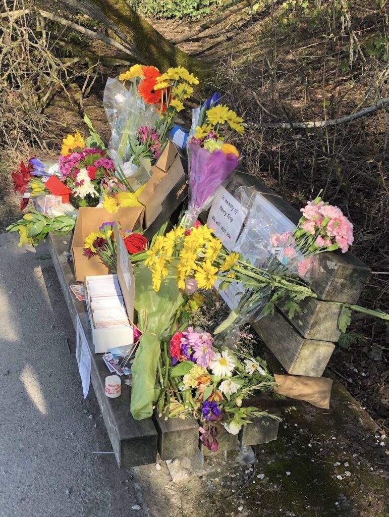 Flowers and notes are left on the bench Henry King frequented after he was killed on March 12, 2023 in Bellingham, Washington. On Wednesday, Dec. 6, 9 months after King’s death, police from Bellingham and Marysville as well as Snohomish County sheriff’s deputies arrested Elijah Belmont in King’s killing. (Photo provided by Kyle Peterson)
