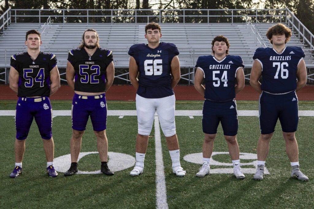 Left to right, Mason Turner (54), Bryce Slezak (52), Willem Van Dongen (66), Kyle Martin (54), and Jake Reid (76) on Dec. 17 at Lake Stevens High School. (Annie Barker / The Herald)
