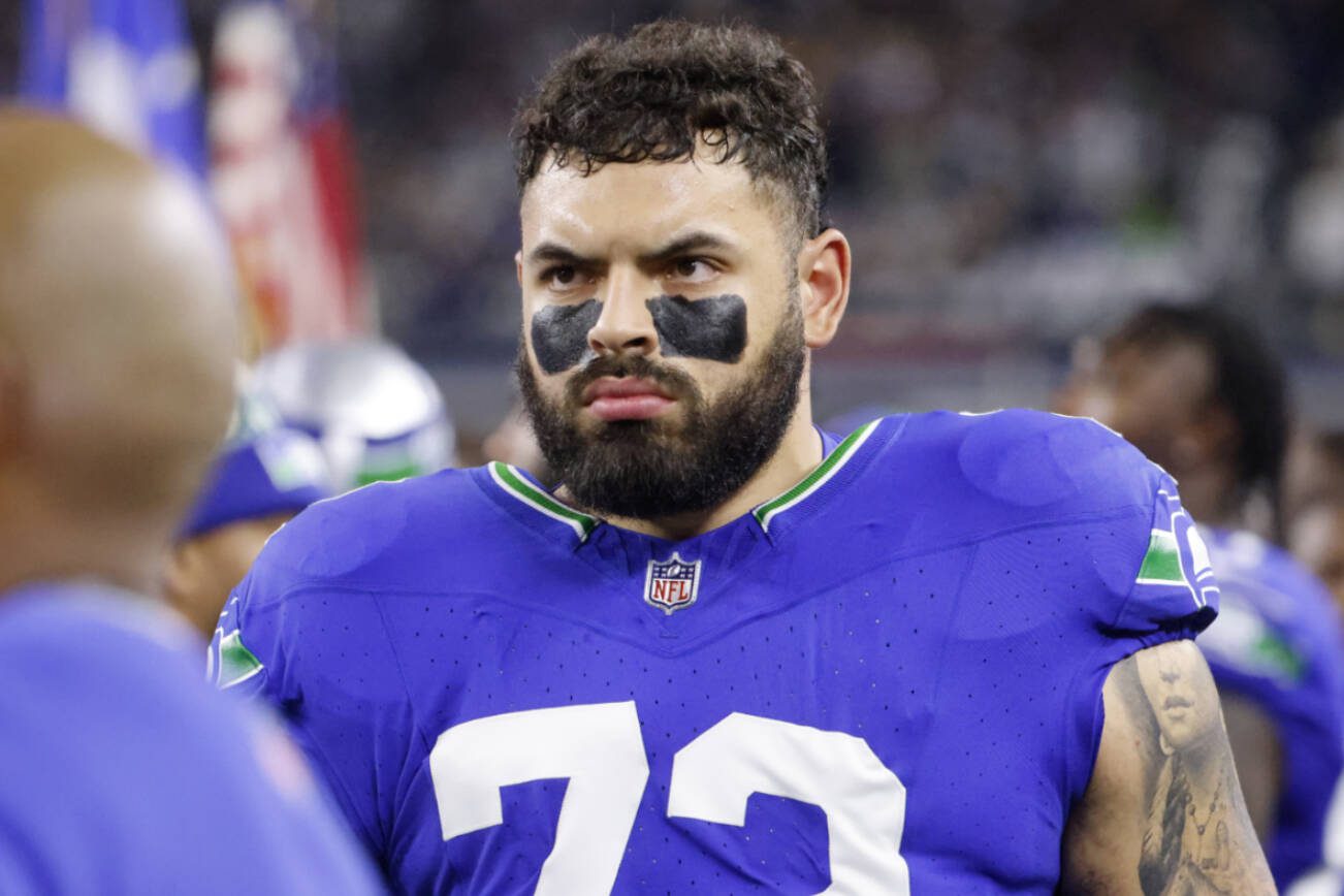 Seattle Seahawks offensive tackle Abraham Lucas (72) walks on the sideline prior to an NFL Football game in Arlington, Texas, Thursday, Nov. 30, 2023. (AP Photo/Michael Ainsworth)