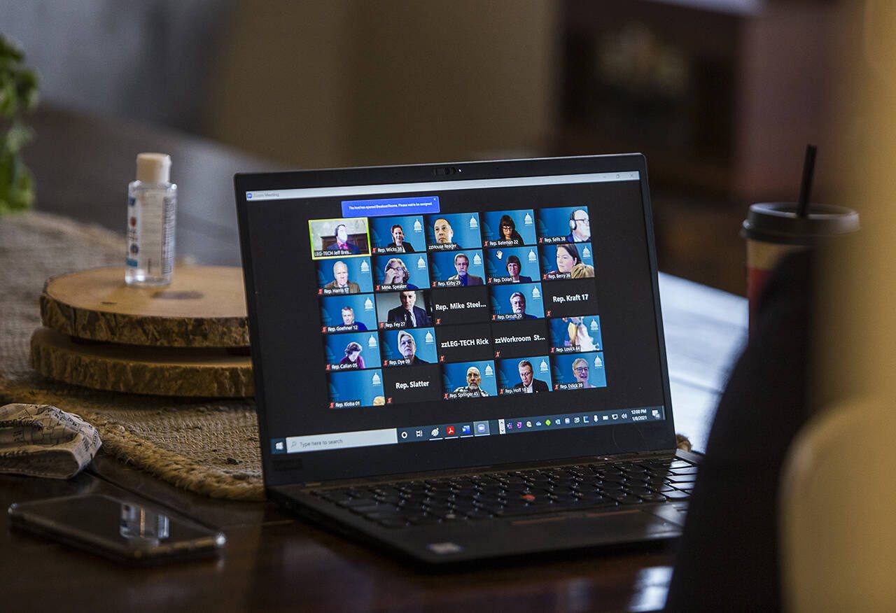 State House representatives respond to a roll call during a virtual meeting before taking the oath of office in January 2020. With local and state government continuing to use teleconferencing for public meetings, new guidelines are necessary to prevent abuses. (Olivia Vanni / The Herald file photo)