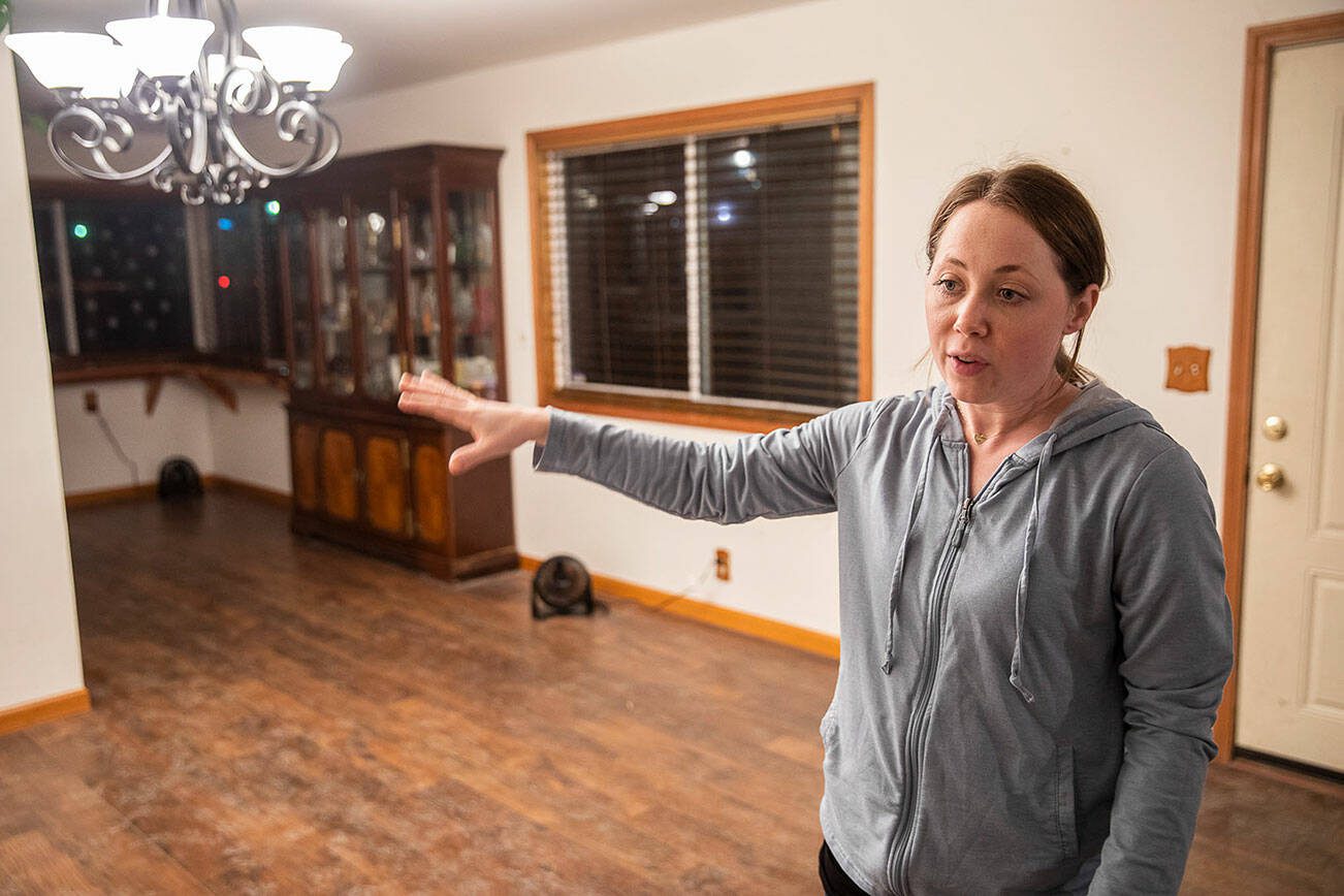 Dannika Prime talks about how the water came into her home on Tuesday, Dec. 12, 2023 in Silvana, Washington. (Olivia Vanni / The Herald)