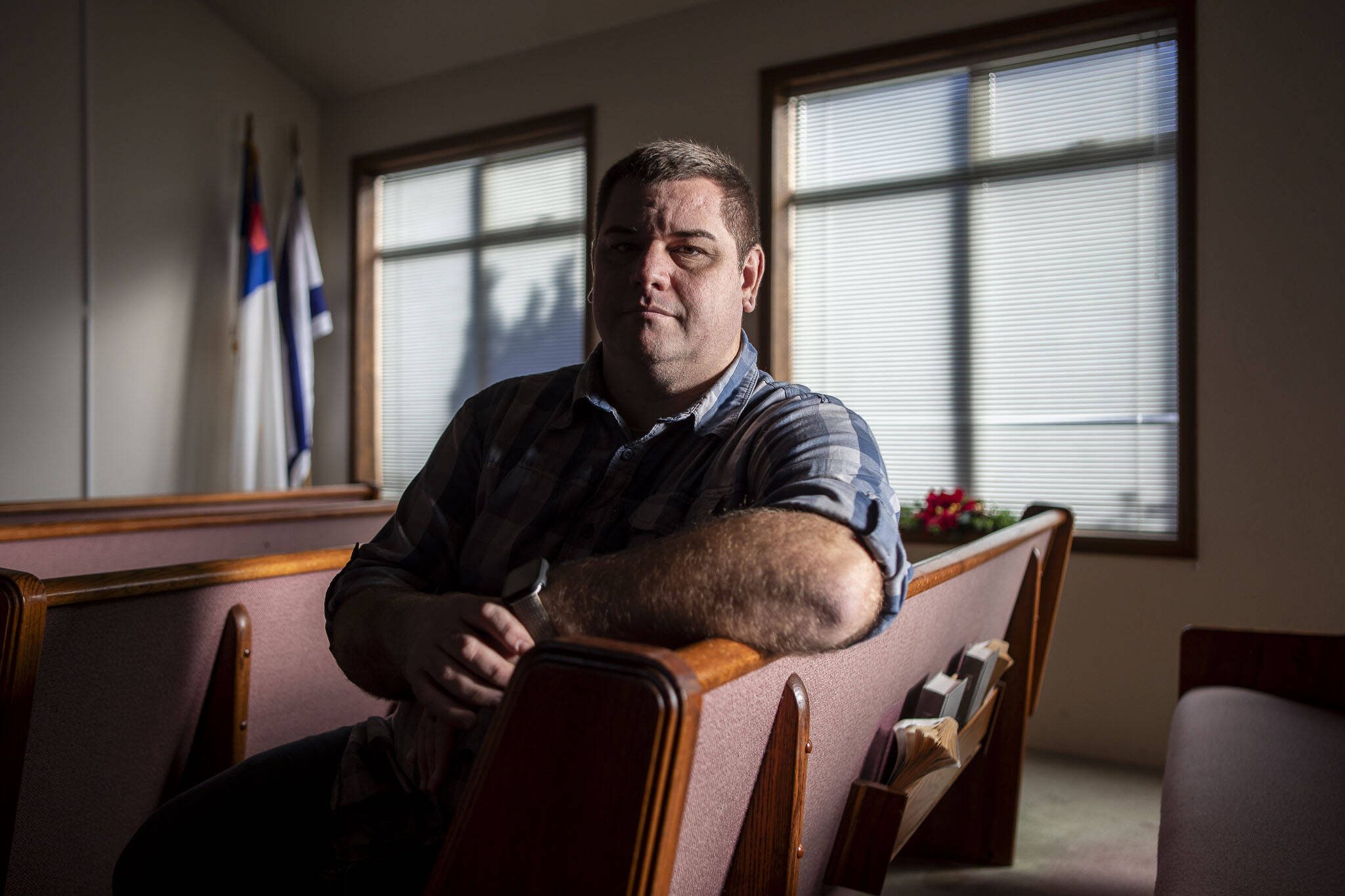 Tim Ziesemer poses for a photo at Glad Tidings Church in Darrington, Washington on Tuesday, Dec. 12, 2023.  (Annie Barker / The Herald)