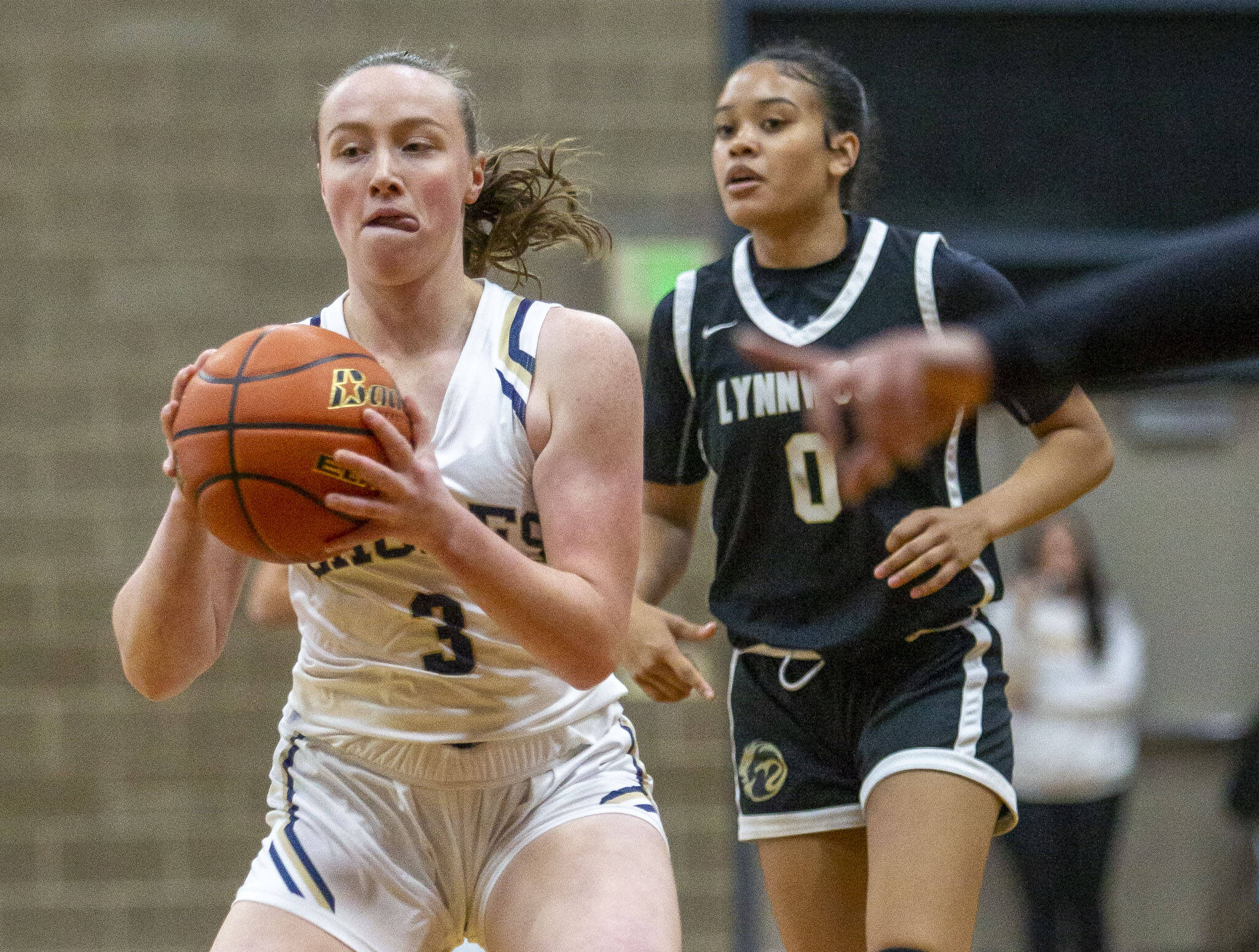 Arlington’s Rachel Snow looks to the pass the ball during the game against Lynnwood on Monday in Arlington. (Olivia Vanni / The Herald)