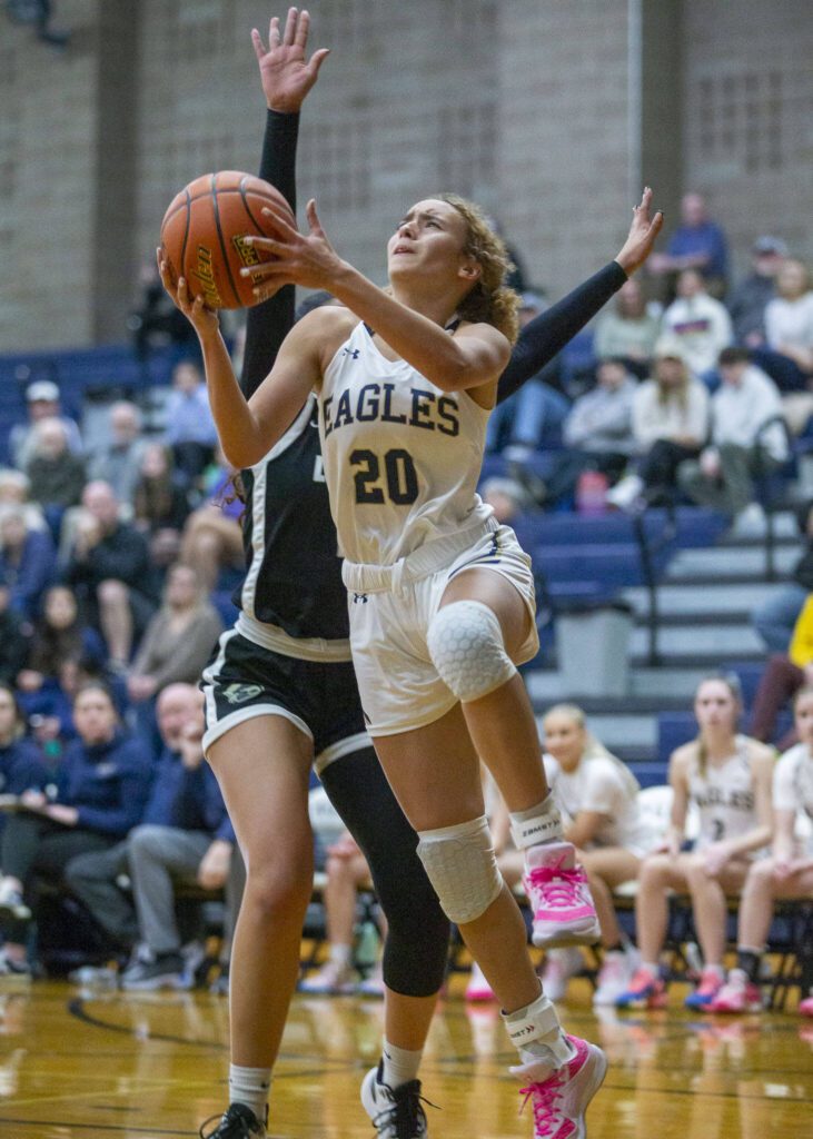 Arlington’s Samara Morrow attempts a layup during the game against Lynnwood on Monday, Dec. 11, 2023 in Arlington, Washington. (Olivia Vanni / The Herald)
