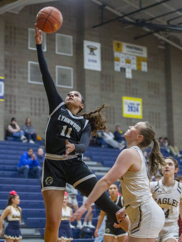 Lynnwood’s Teyah Clark makes a layup during the game against Arlington on Monday, Dec. 11, 2023 in Arlington, Washington. (Olivia Vanni / The Herald)
