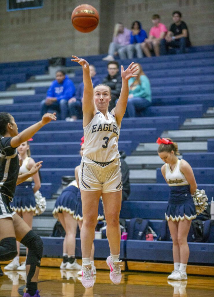 Arlington’s Rachel Snow makes a three-point shot during the game against Lynnwood on Monday, Dec. 11, 2023 in Arlington, Washington. (Olivia Vanni / The Herald)
