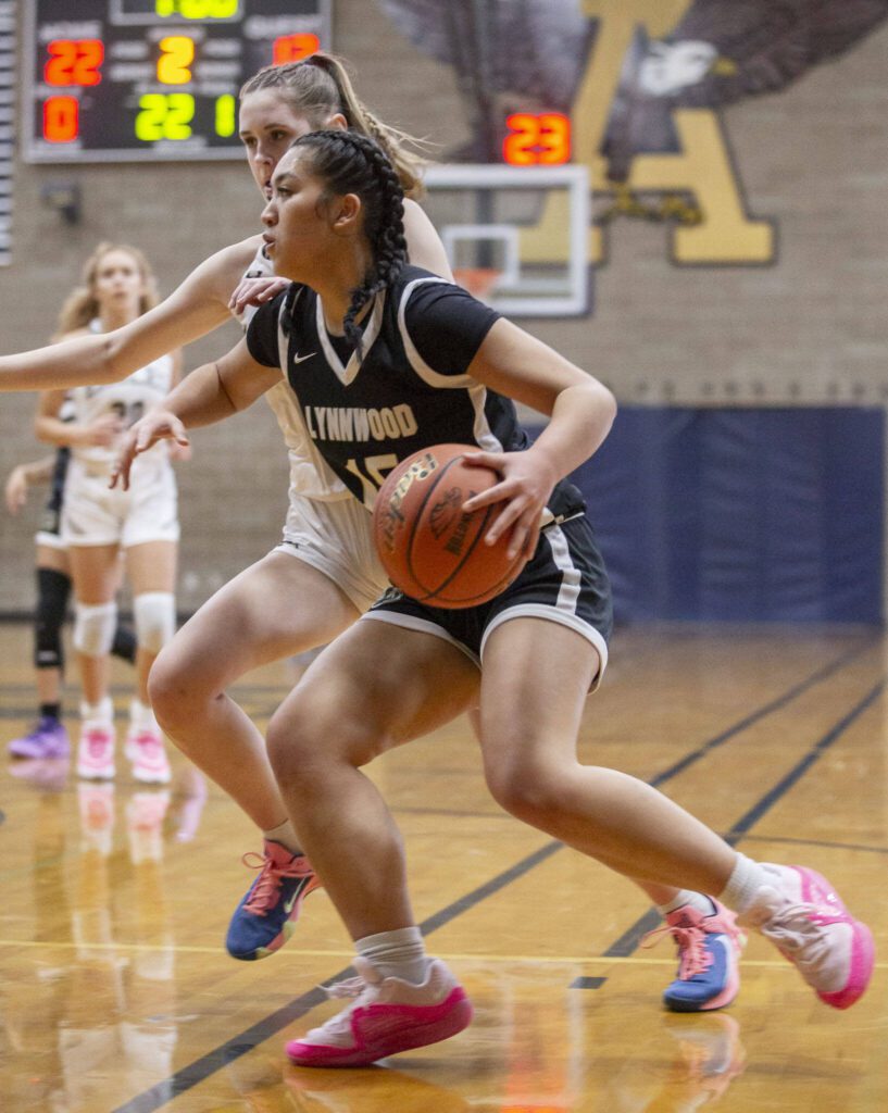 Lynnwood’s Jocelyn Tamayo drives to the hoop during the game against Arlington on Monday, Dec. 11, 2023 in Arlington, Washington. (Olivia Vanni / The Herald)
