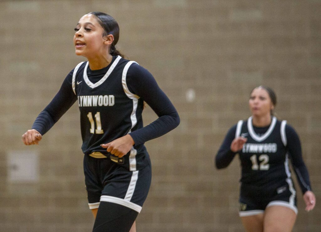 Lynnwood’s Teyah Clark reacts to a teammate drawing a foul call during the game against Arlington on Monday, Dec. 11, 2023 in Arlington, Washington. (Olivia Vanni / The Herald)
