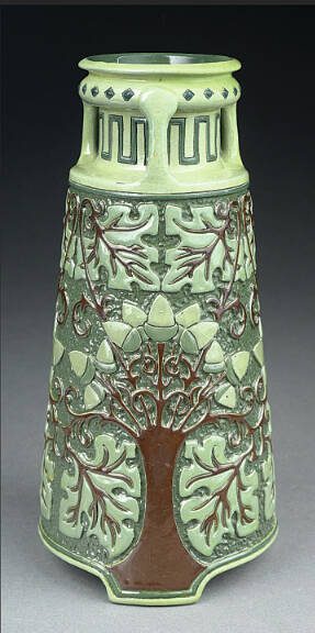 Rhead, Roseville and Della Robbia are three of the most important names in American art pottery. All of them apply to this vase.
