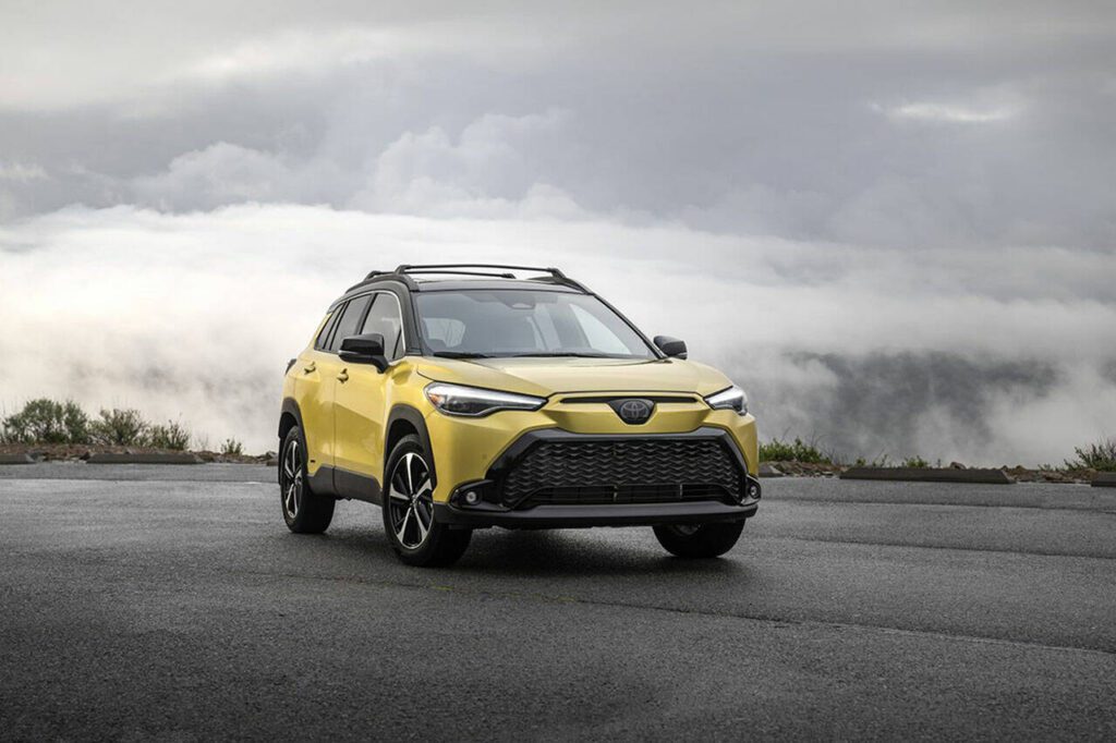The 2023 Toyota Corolla Cross Hybrid XSE, shown here in Acidic Blast paint subdued by gray skies. (Toyota)
