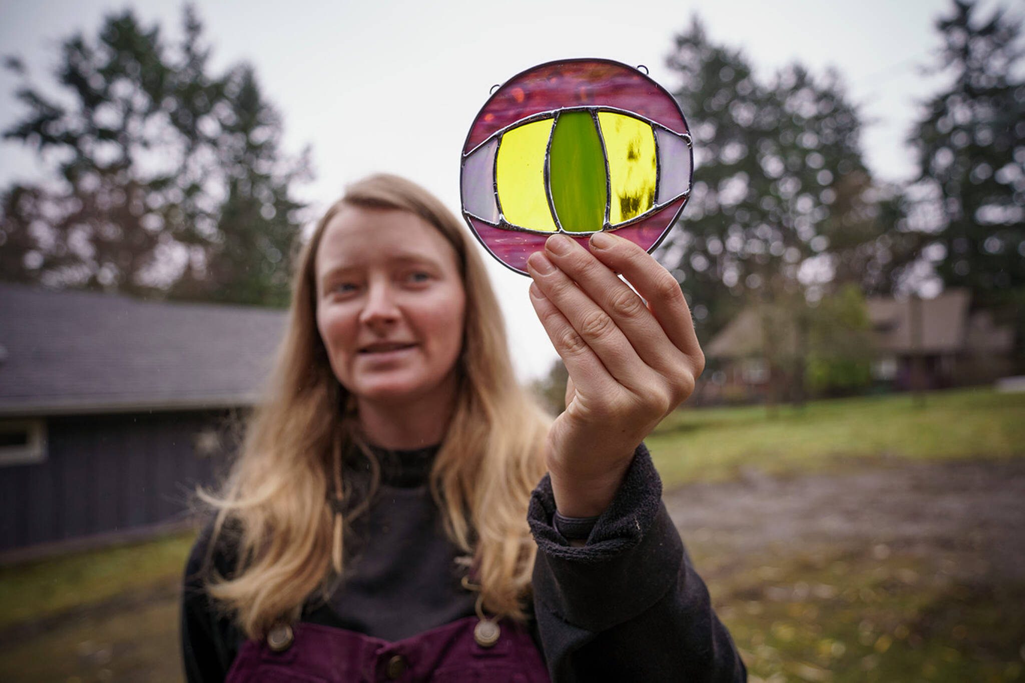 Mackensie Bennett holds a piece that reminds some people of the Eye of Sauron, and others of an alligator. (Photo by David Welton)