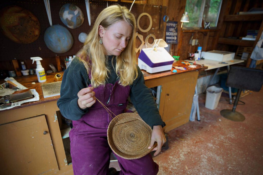 Besides stained glass pieces, Mackensie Bennett also weaves baskets from pine needles. (Photo by David Welton)
