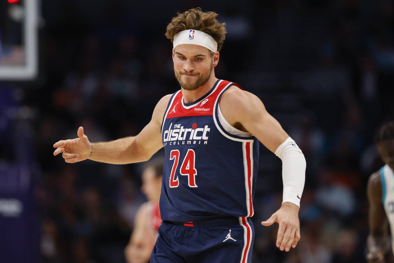 Washington Wizards forward Corey Kispert reacts after making a three pointer against the Charlotte Hornets during the second half of an NBA basketball game in Charlotte, N.C., Wednesday, Nov. 8, 2023. (AP Photo/Nell Redmond)