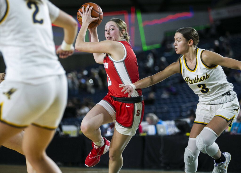 Stanwood’s Ellalee Wortham drives to the hoop during a Class 3A state quarterfinal game against Mead on March 2 in Tacoma. (Olivia Vanni / The Herald)
