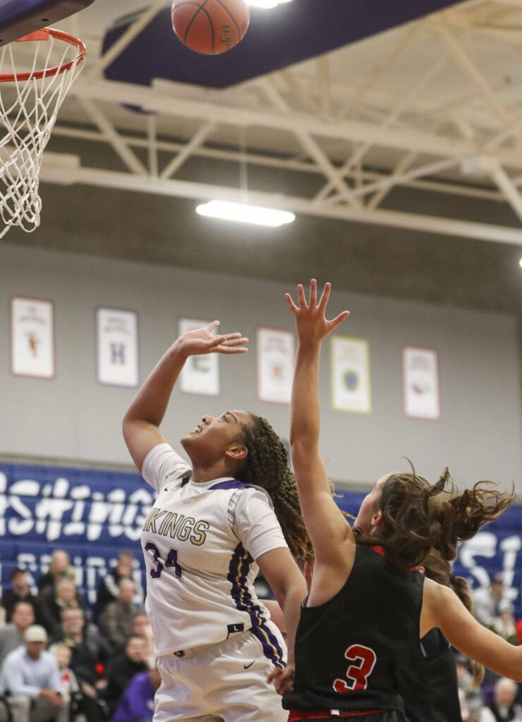 Lake Stevens’ Nisa Ellis (34) shoots the ball during a game against Mount Si on Feb. 16 in Kirkland. (Annie Barker / The Herald)
