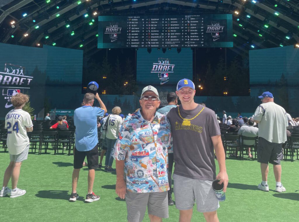 Former longtime Everett Community College men’s basketball coach Larry Walker and grandson Ethan Martin during MLB All-Star weekend in Seattle. (Photo courtesy of Larry Walker)
