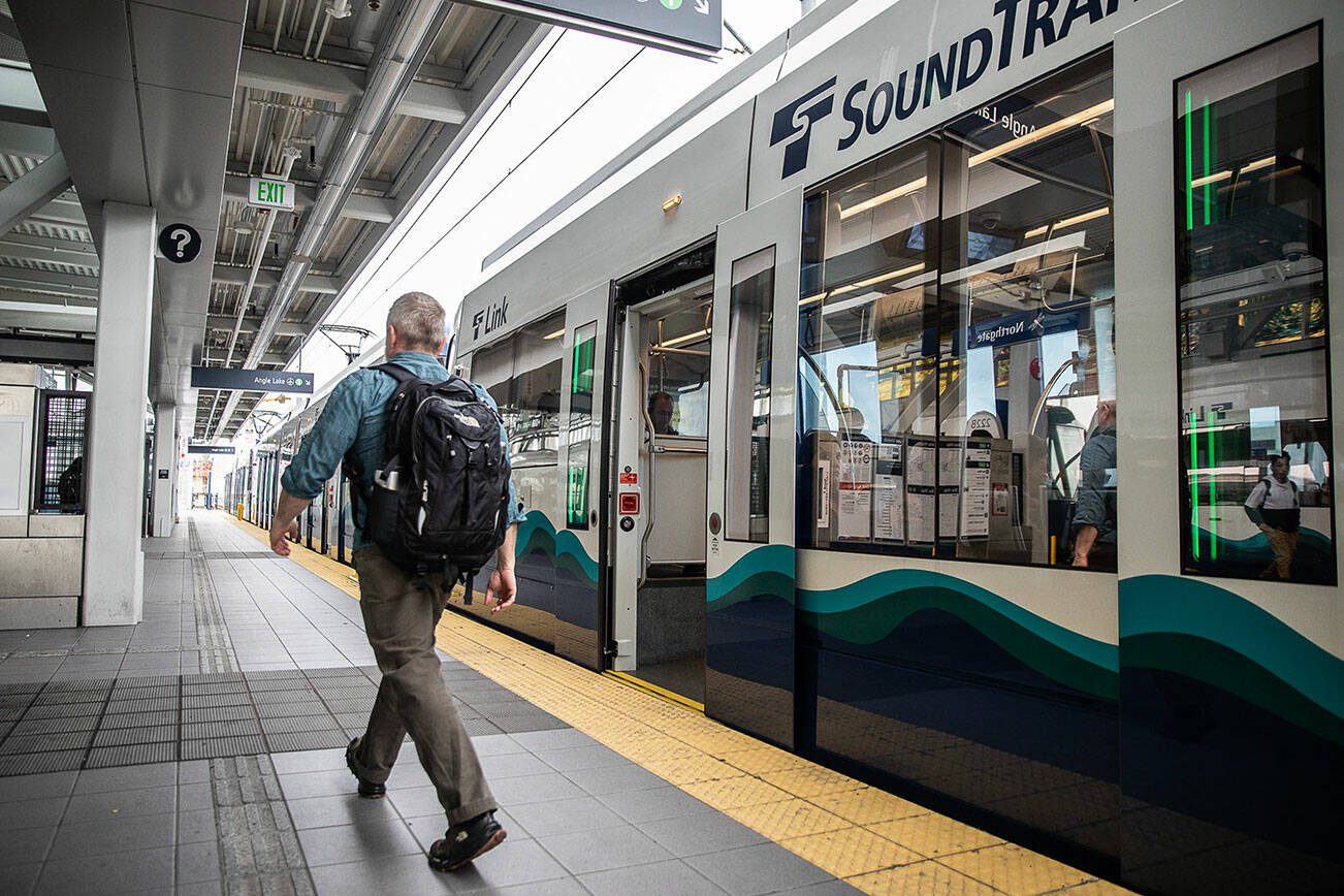 A person steps off the light rail at Northgate Station on Wednesday, Oct. 4, 2023 in Seattle, Washington. (Olivia Vanni / The Herald)