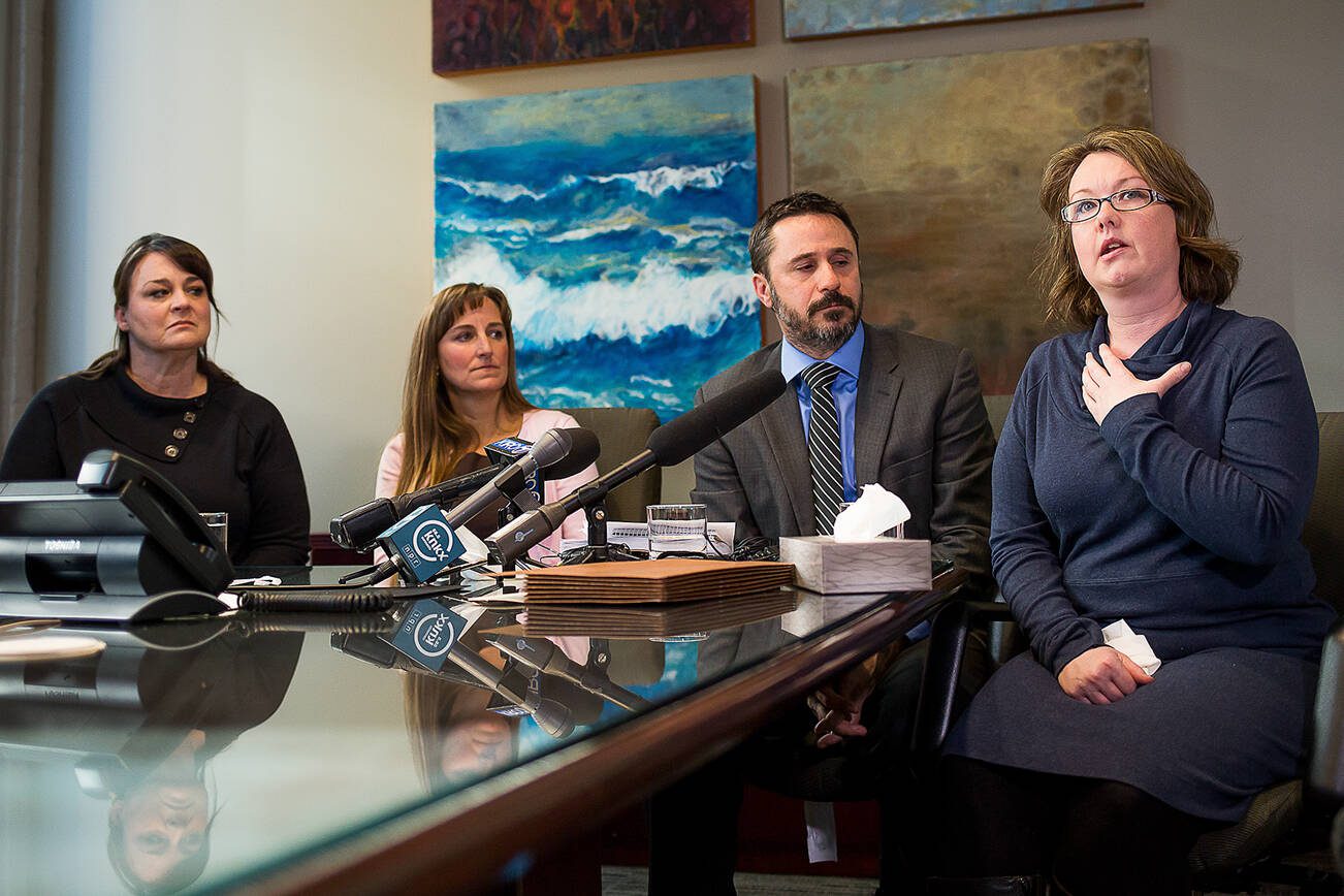 David Rzegocki

Arica Smith-Simmer (right), a parent of two children at Sky Valley Education Center, gives an account of her health issues as Jill Savery (left), Stacy Mullen-Deland (center left), and attorney Sean Gamble listen during a press conference in downtown Seattle on Wednesday, Jan. 3, 2018.

Photo taken on 01032018