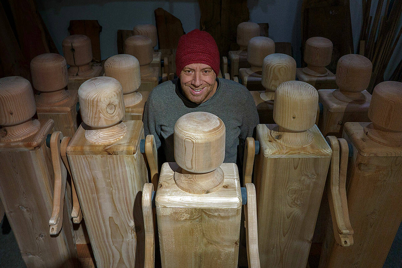 Kelly Cameron of Turnco Wood Goods created a bevy of giant wooden doll sculptures as part of a grant that was awarded to the Clinton Chamber of Commerce. (Photo by David Welton)