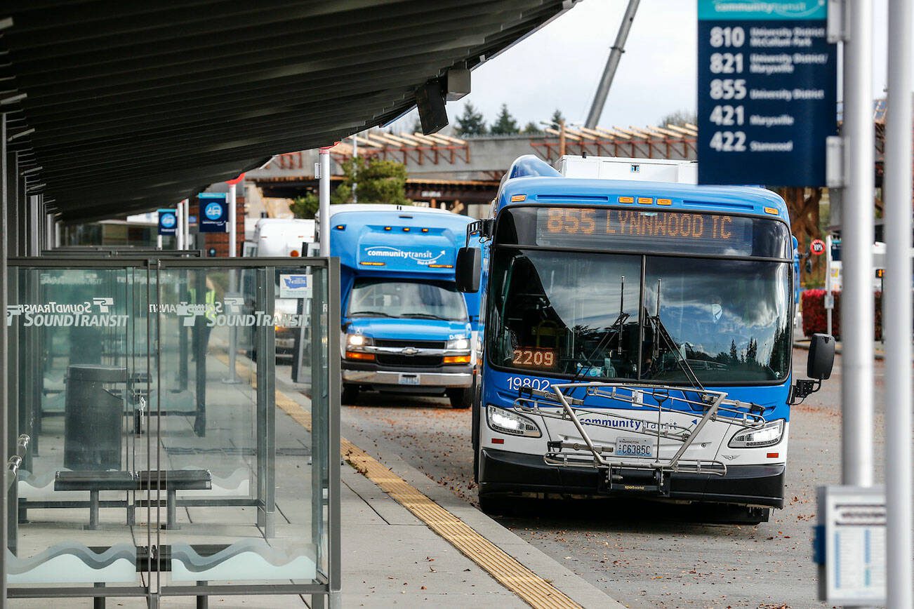 Community Transit is preparing to shift commuter buses that go to the University of Washington in Seattle to connect with Link light rail in Northgate next year. (Kevin Clark / The Herald)