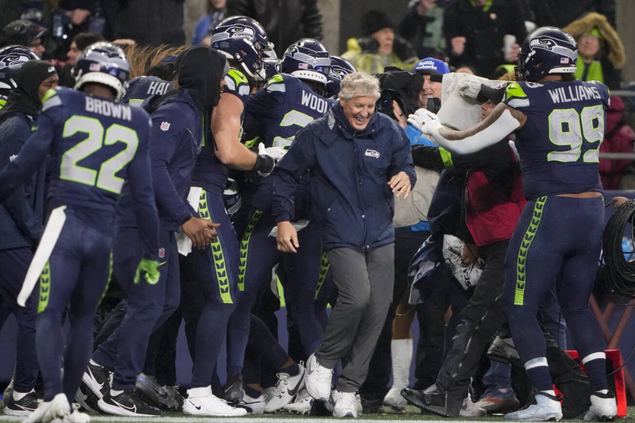 Seattle Seahawks head coach Pete Carroll reacts as players gather during the second half of an NFL football game against the Philadelphia Eagles, Monday, Dec. 18, 2023, in Seattle. The Seahawks won 20-17. (AP Photo/Lindsey Wasson)