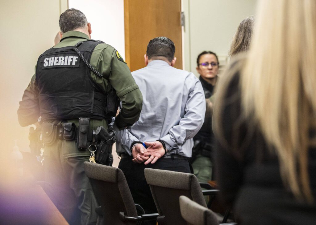 Richard Rotter is walked out of the courtroom in handcuffs after being found guilty of aggravated first-degree murder at the Snohomish County Courthouse on Monday, April 3, 2023, in Everett, Washington. (Olivia Vanni / The Herald)
