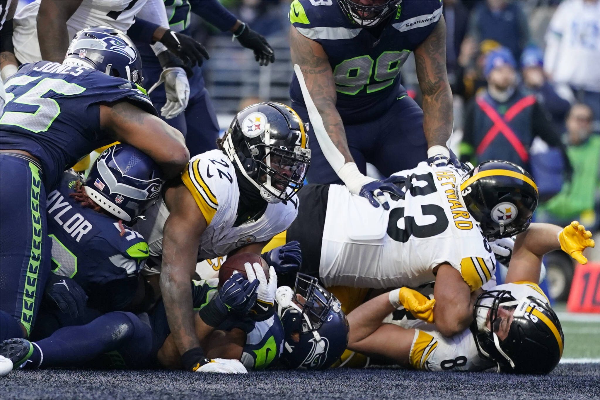 Pittsburgh Steelers running back Najee Harris (22) carries the Seattle Seahawks’ defense into the end zone in the second half of Sunday’s game in Seattle. (AP Photo/Lindsey Wasson)