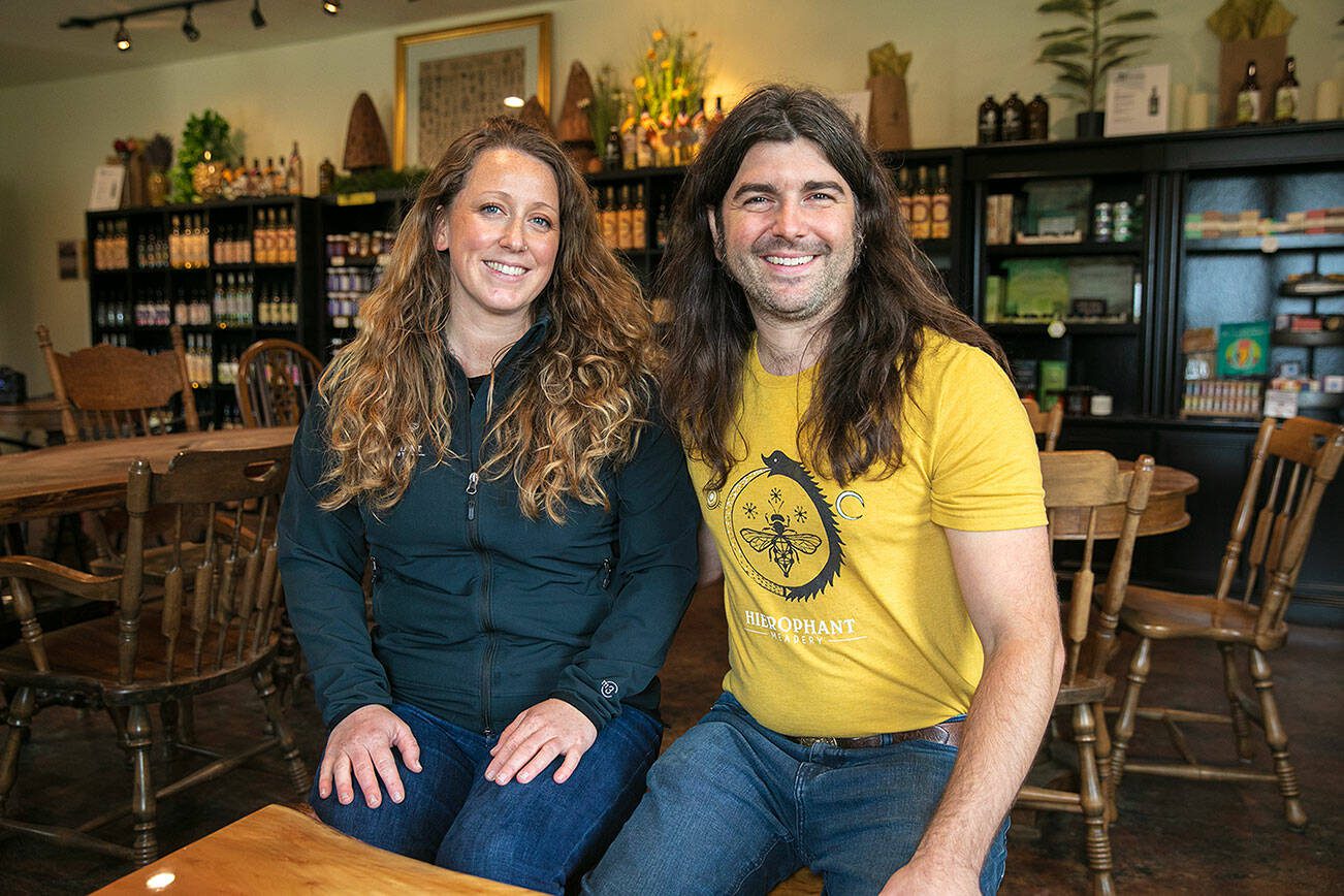 Hierophant Meadery owners and operators Michelle Scandalis and Jeremy Kyncl sit in the tasting room on Wednesday, Oct. 4, 2023, in Freeland, Washington. (Ryan Berry / The Herald)