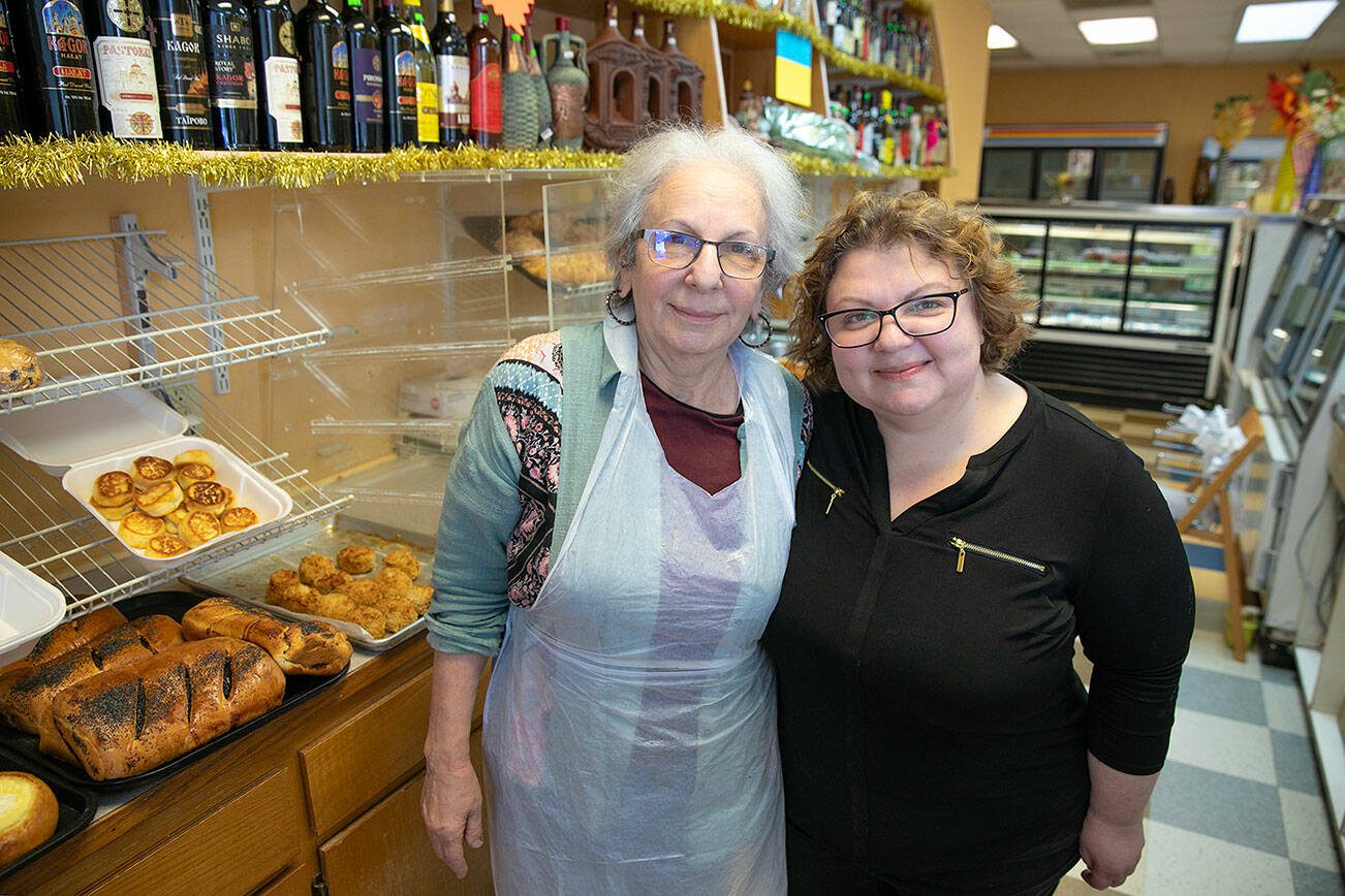 Olga Gershaft, right, and her mother Galina Braynina stand behind the counter at European Deli Svitlana on Thursday, Oct. 12, 2023, on Everett Mall Way in Everett, Washington. (Ryan Berry / The Herald)