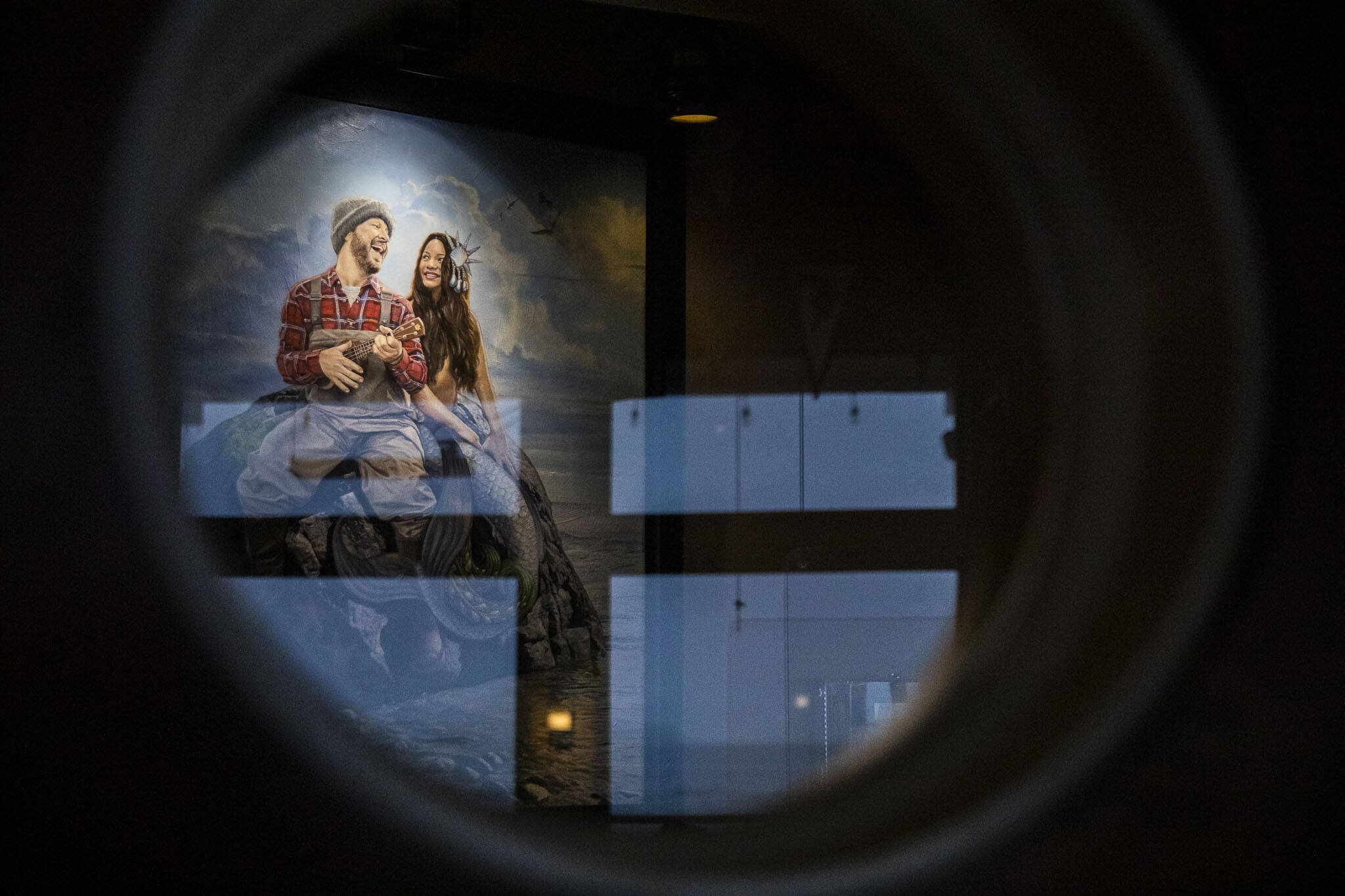 Ivar’s Mystery Painting seen through porthole window on Thursday, Dec. 14, 2023 in Mukilteo, Washington. (Olivia Vanni / The Herald)