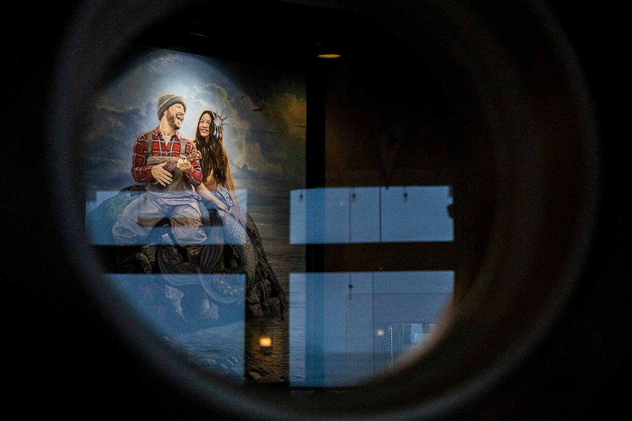 Ivar’s Mystery Painting seen through porthole window on Thursday, Dec. 14, 2023 in Mukilteo, Washington. (Olivia Vanni / The Herald)