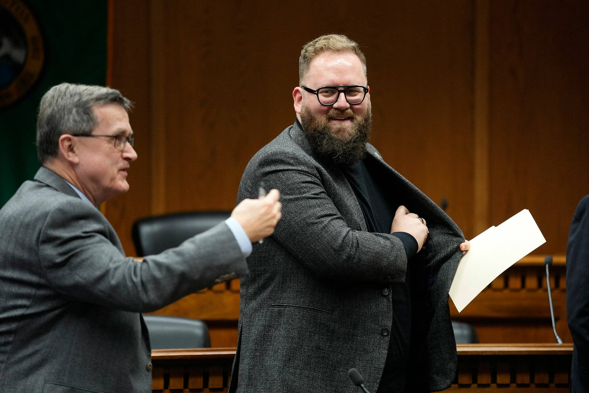 Sen. Marko Liias, D-Edmonds, chair of the Senate Transportation Committee, at right, looks over at Sen. Curtis King, R-Yakima, ranking minority member of Senate Transportation Committee, at left, after participating in a panel during a legislative session preview in the Cherberg Building at the Capitol, Thursday, Jan. 4, 2024 in Olympia, Washington. (AP Photo/Lindsey Wasson)