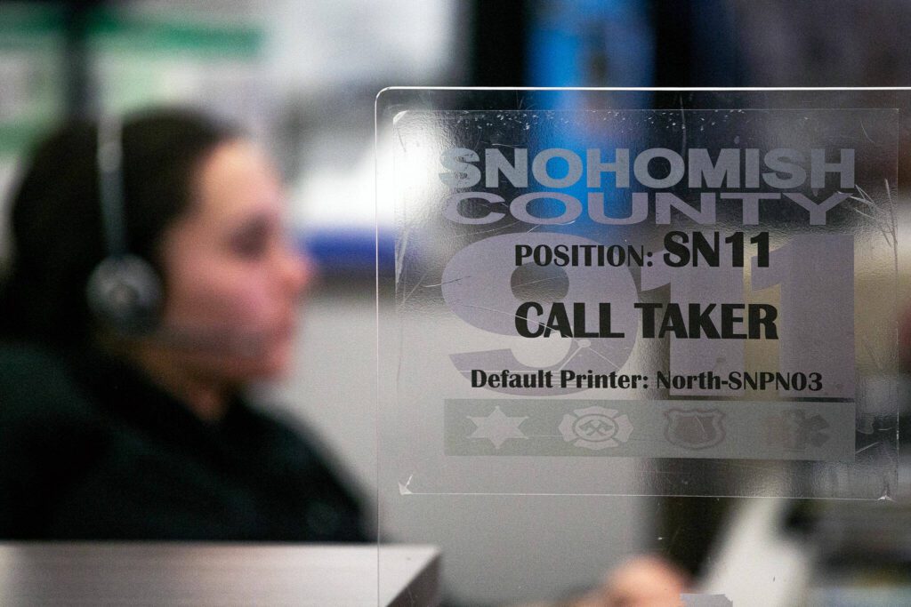 A 911 dispatcher works at the Snohomish County 911 dispatch center Thursday, Jan. 18, 2024, in Everett, Washington. (Ryan Berry / The Herald)
