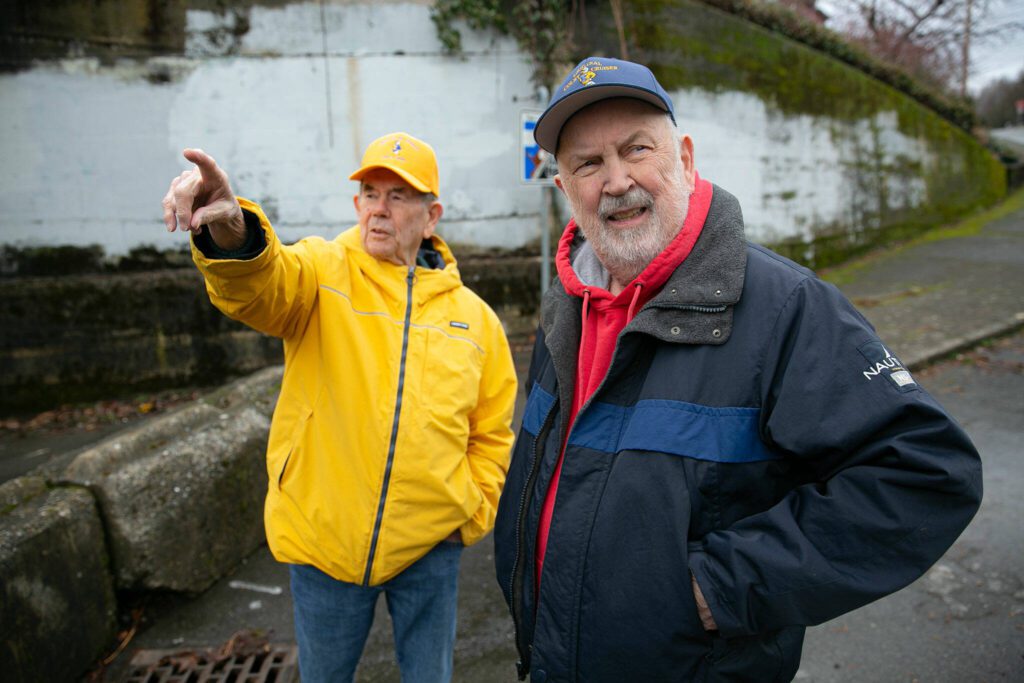 Larry and Jack O’Donnell reminisce about the area around the Bond Street underpass on Friday, Jan. 19, 2024, in the Port Gardner neighborhood of Everett, Washington. The underpass used to serve as a public and commercial access to the waterfront but is now blocked off. Nearby Forgotten Creek Park and Trail have deteriorated since the closure of the underpass. (Ryan Berry / The Herald)
