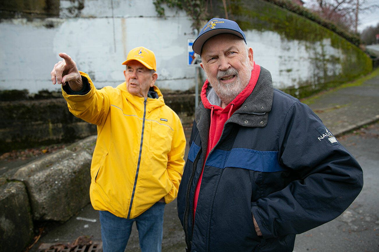 Larry and Jack O’Donnell reminisce about the area around the Bond Street underpass on Friday, Jan. 19, 2024, in the Port Gardner neighborhood of Everett, Washington. The underpass used to serve as a public and commercial access to the waterfront but is now blocked off. Nearby Forgotten Creek Park and Trail have deteriorated since the closure of the underpass. (Ryan Berry / The Herald)