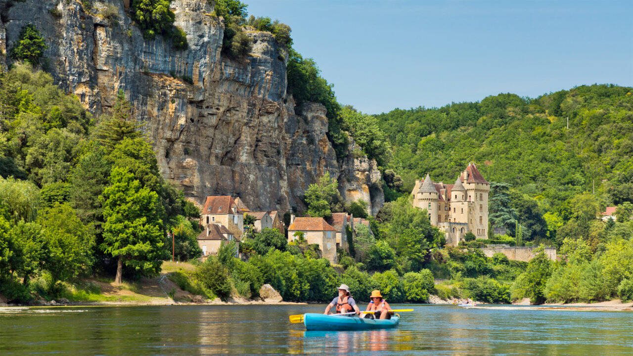 Kayaking from La Roque down river. Canoeing on the Dordogne River offers stunning views around every bend. (Dominic Arizona Bonuccelli / Rick Steves’ Europe)