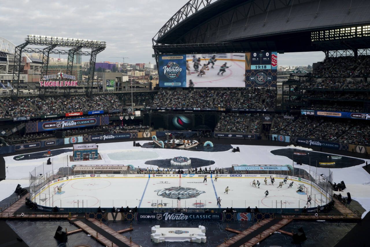 The Seattle Kraken and the Vegas Golden Knights play during the first period of the NHL Winter Classic on Monday in Seattle. (AP Photo/Lindsey Wasson)