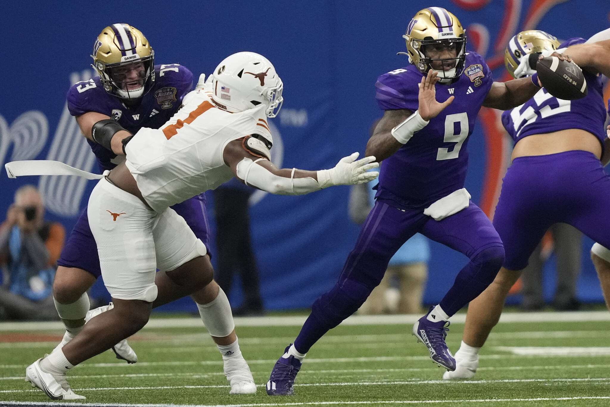 Washington quarterback Michael Penix Jr. (9) scrambles with the ball against Texas during the second half of the Sugar Bowl on Monday in New Orleans. (AP Photo/Gerald Herbert)