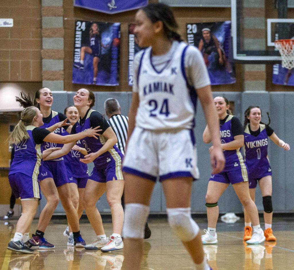 Lake Stevens players celebrate beating Kamiak on Wednesday, Jan. 3, 2024 in Mukilteo, Washington. (Olivia Vanni / The Herald)
