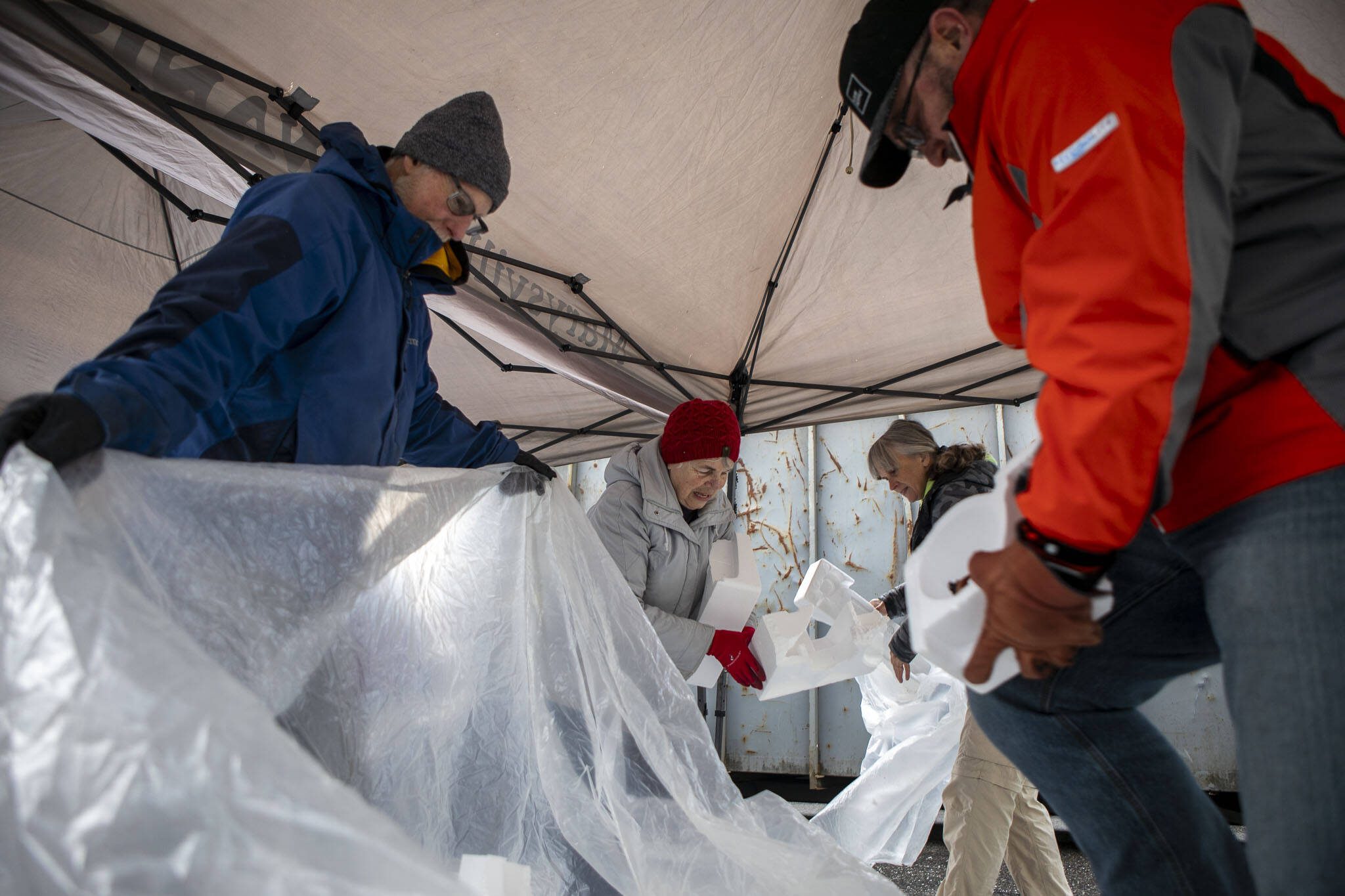 Volunteers break down and collect styrofoam during a recycling event at 1049 State Ave in Marysville, Washington on Saturday, Jan. 6, 2024. (Annie Barker / The Herald)