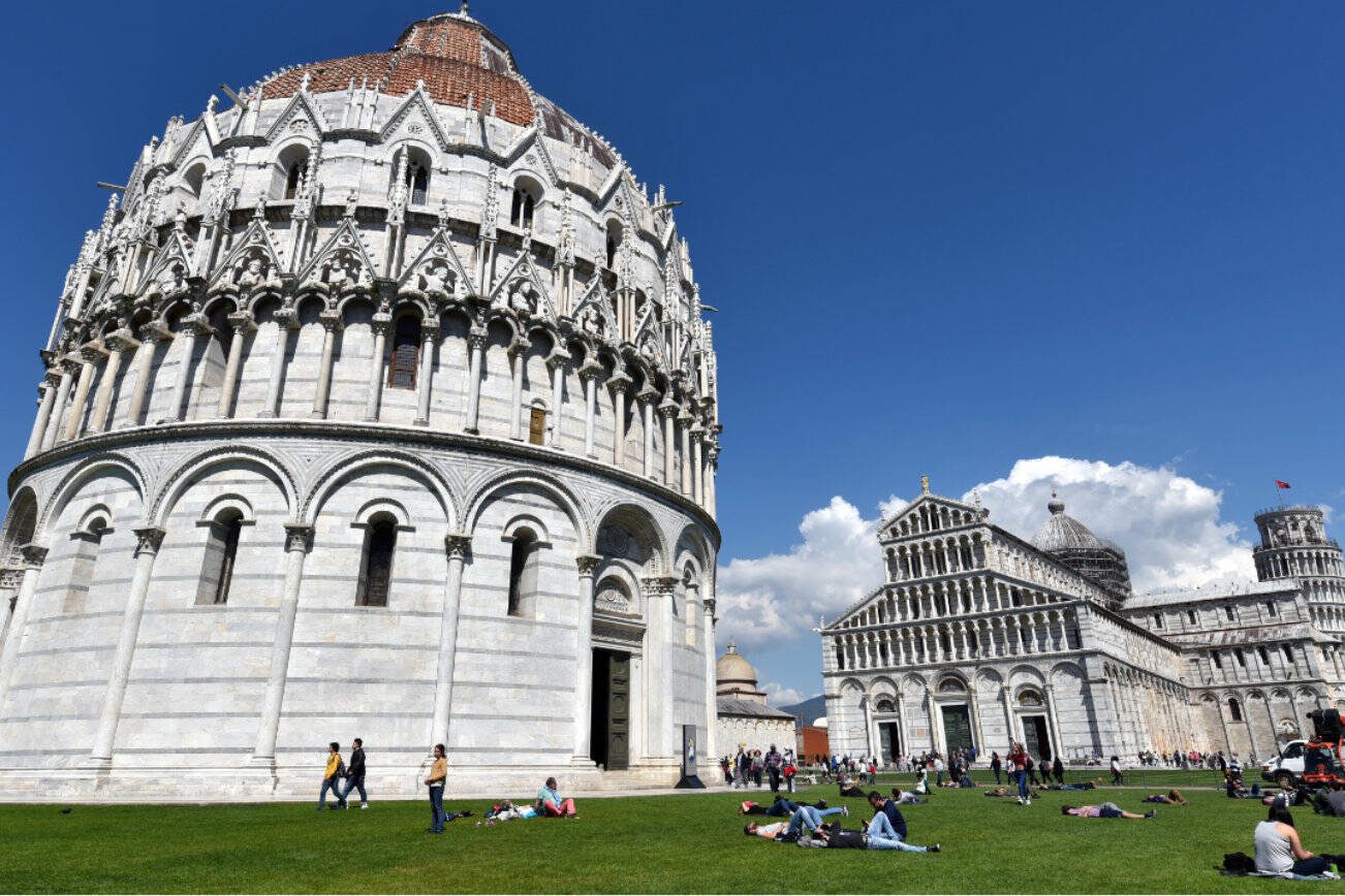 On the Field of Miracles, Pisa’s Baptistery is Italy’s biggest, with interior ambience, a hexagonal pulpit, and impressive acoustics. (Cameron Hewitt / Rick Steves' Europe)