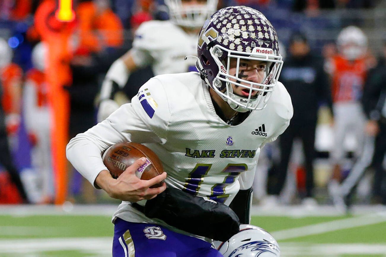 Lake Stevens quarterback Kolton Matson keeps it himself for a long first half run against Graham-Kapowsin during the WIAA 4A Football State Championship on Saturday, Dec. 2, 2023, at Husky Stadium in Seattle, Washington. (Ryan Berry / The Herald)