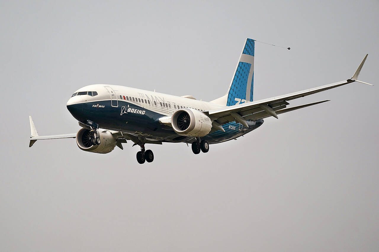 A Boeing 737 Max jet prepares to land at Boeing Field following a test flight in Seattle. (AP Photo/Elaine Thompson, File)