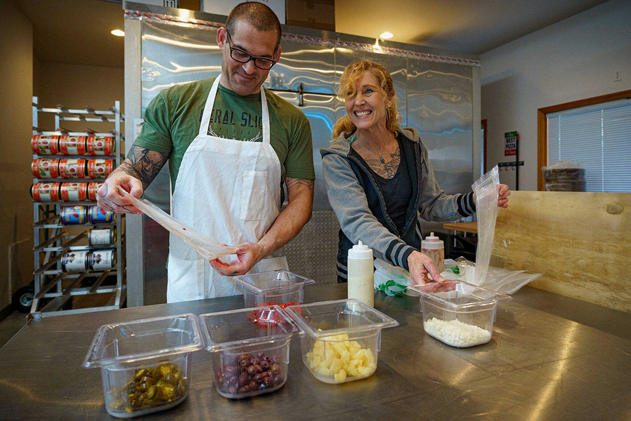 Paul and Lila Sarkis are the owners of Feral Slice Pizza, a take-and-bake pizza business based in Clinton, Washington. (Photo by David Welton)