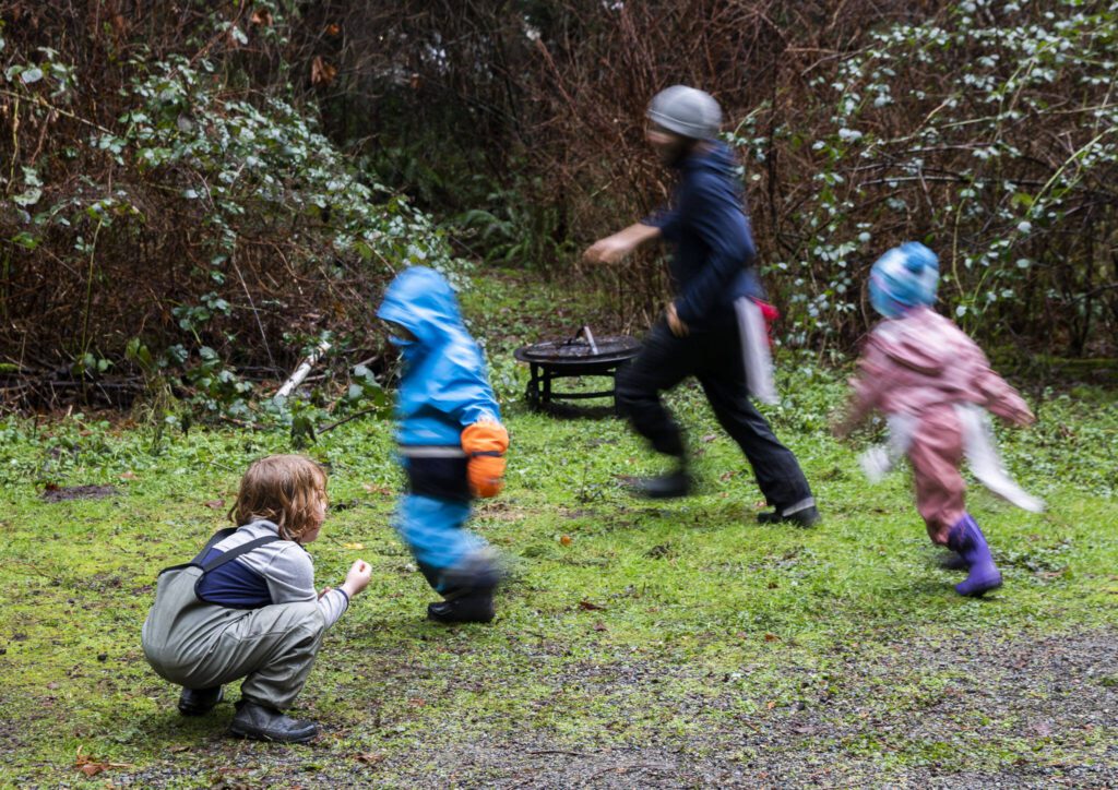 Students run around while playing a game of fox tail on Monday, Jan. 22, 2024 in Camano Island, Washington. (Olivia Vanni / The Herald)
