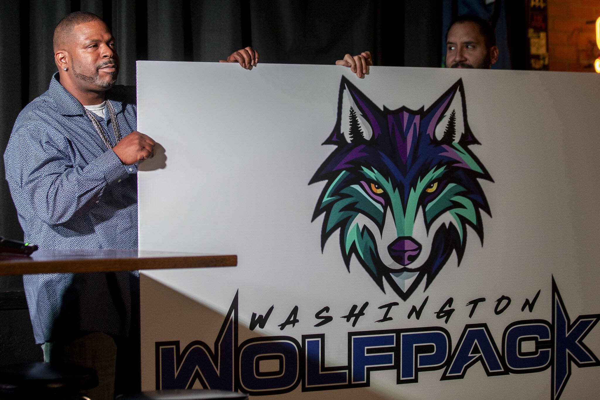 The Washington Wolfpack logo is revealed for Everett’s new AFL team on Oct. 26, 2023, at Tony V’s Garage in Everett. (Annie Barker / The Herald)