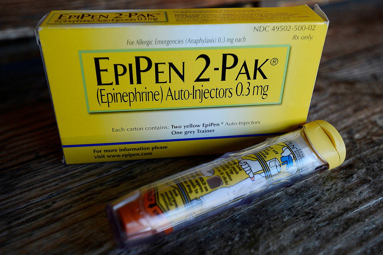 FILE - This Oct. 10, 2013, file photo, shows an EpiPen epinephrine auto-injector, a Mylan product, in Hendersonville, Texas. Mylan reports financial results Tuesday, Aug. 9, 2016. (AP Photo/Mark Zaleski, File)