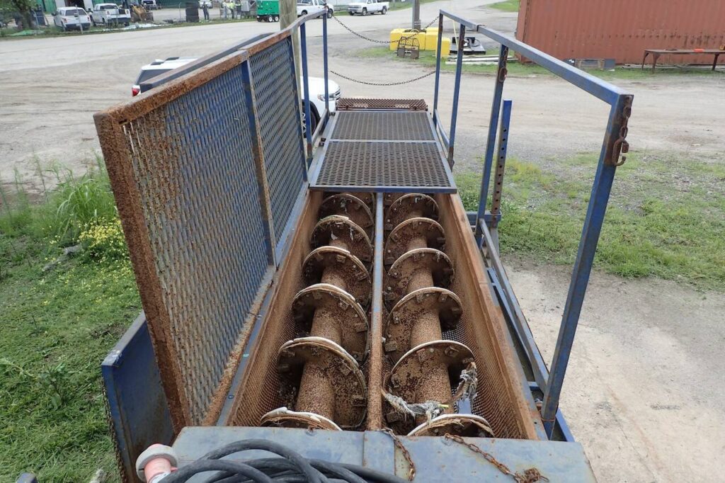 A close up of the unprotected augurs at the Marysville Wastewater Treatment Plant in Marysville, Washington. Sergey Devyatkin was assigned to clean the augurs while working the night shift at the 2020 City of Marysville Biosolids Removal and Remediation Project. (Chad Jones/The Stritmatter Firm) 

